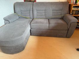 Ecksofa mit Ottomane und Schlaffunktion