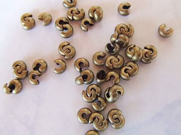Perlen (unechte): 20 Crimp Cover bronze 4mm – Neu (gemäss Beschreibung) aus Alpnachstad von perlengaby