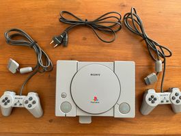 Console de jeu Sony PlayStation avec  7 jeux
