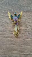 magnifique broche perroquet scintillant