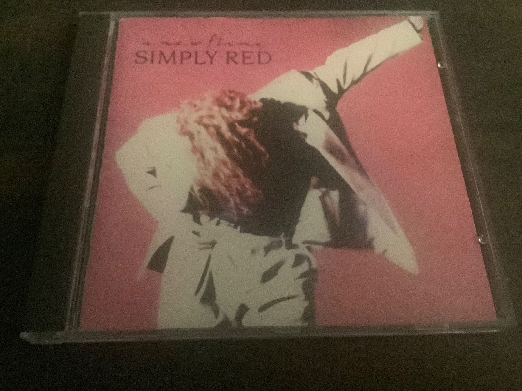 CD: Simply Red / a new flame / 1989 – Usato da Dübendorf venduto da Shreck