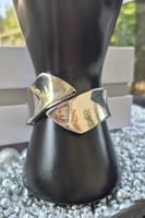 Bracciale rigido effetto argento design moderno