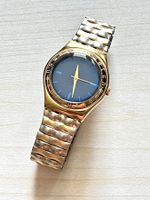 Swatch Uhr Goldfarben blaues Zifferblatt