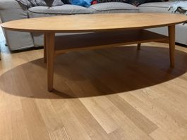 Oval coffee table light wood with shelf