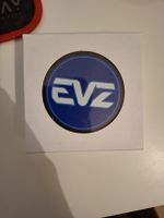 EVZ Eishockey Puck mit Logo in weisser Box neu