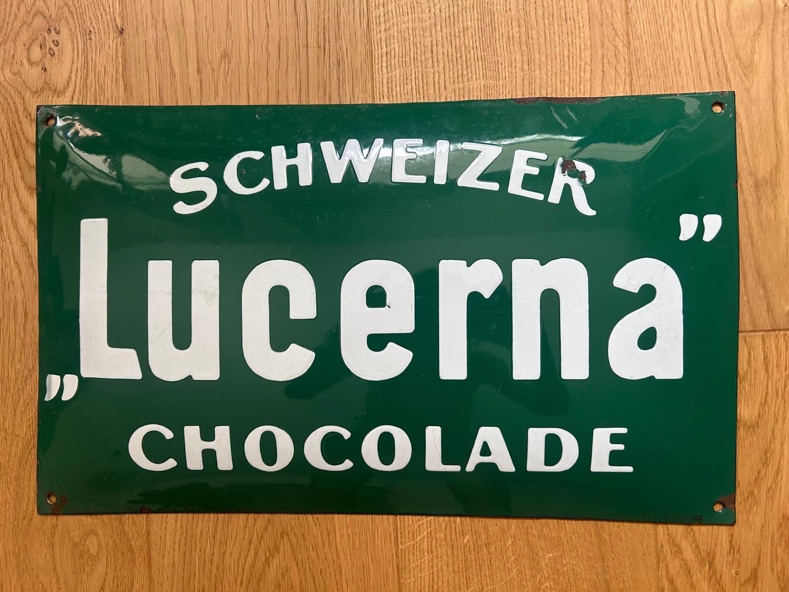 Insegne: **Antikes Emaille Reklameschild Lucerna Chocolade Schweiz** – Usato da Pieterlen venduto da GoOnStage