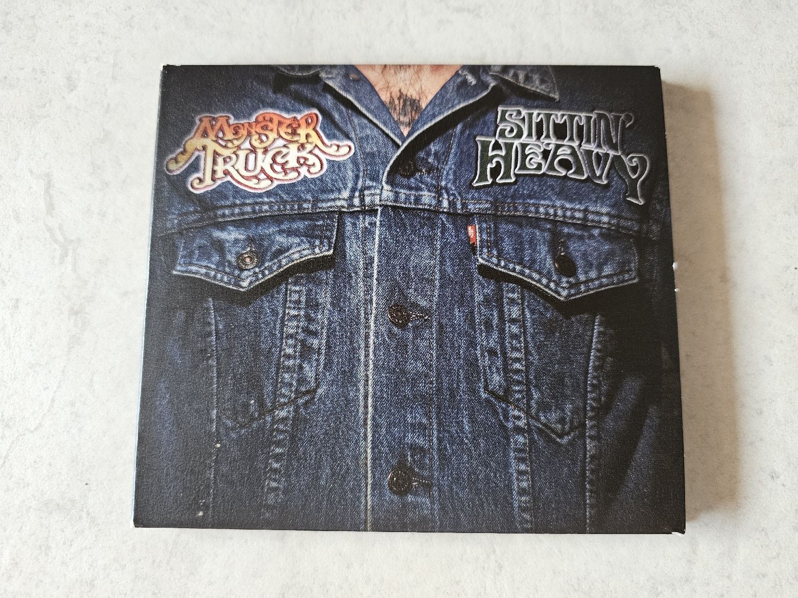 CD: Monster Truck  -  Sittin' Heavy – Usato da Schneisingen venduto da backstore24