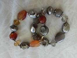 2 Bracelets, one in grey tones and one in brown tone 