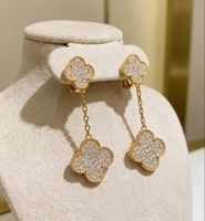 Paire de boucles d'oreilles trèfle full diamond