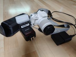 Canon EOS 100D White + lens + flash + bag