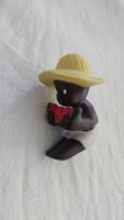 Statuetta bambino che mangia anguria