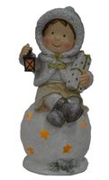 LED Figur Kind sitzend auf Kugel 33 cm