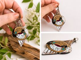 BOUCLE D'OREILLE ARTISTIQUE yin/yang/cygne