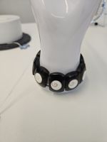 Armband schwarz mit weissen Schneckenhaus Shiva Auge