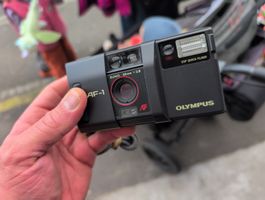 Olymus AF-1 (auch tutti.ch, gratis Versand)