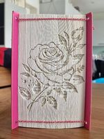 Buchkunst mit Rosenbild