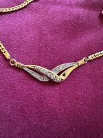Collier en plaqué or , pierres en  zirconium 