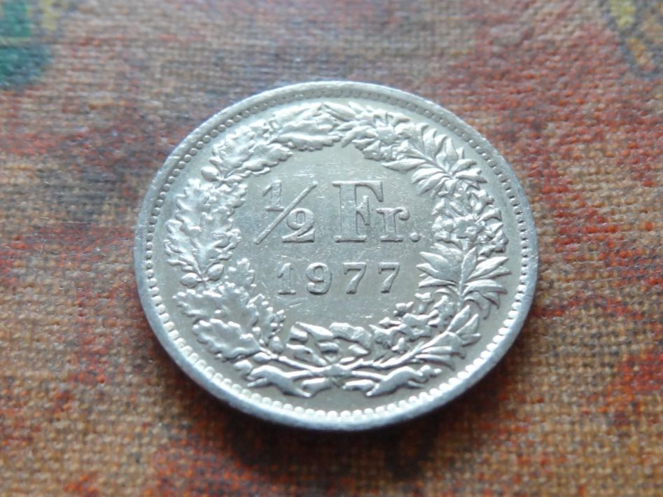 Tutti le monete: 1/2 Fr. 1977 – Usato da Romanel-sur-Lausanne venduto da Swift13