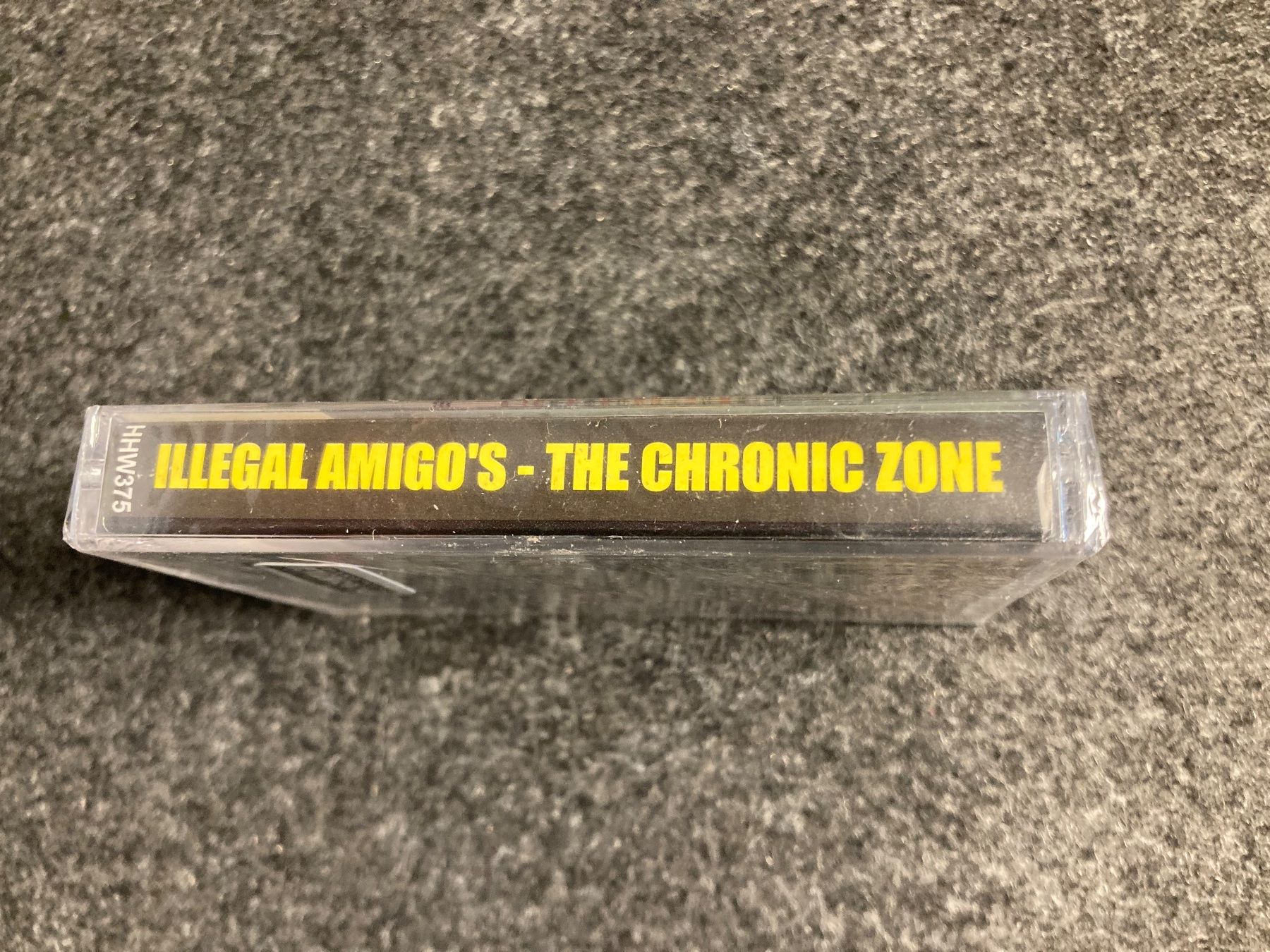 Musicassette: Illegal Amigo's - The Chronic Zone (MC) – Nuovo e nell'imballaggio originale da Fribourg venduto da Karushi 1