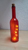 Glasflasche mit Sternen