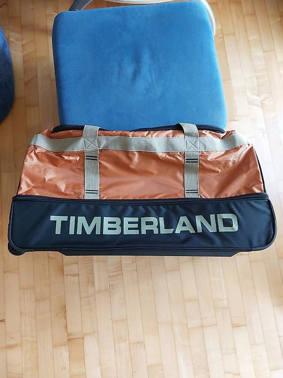Timberland Taschen: Robuste Timberland Reisetasche mit Rollen – Gebraucht aus Flaach von nad_xpb7