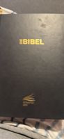 Die Bibel Schlachter paar Seiten sind bisschen weg also 2-3s