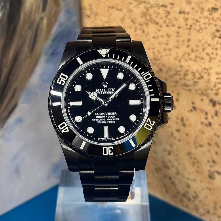 Uhren: Rolex Submariner "No-Date" Black-Out 114060 – Gebraucht aus Genève von minty.watches