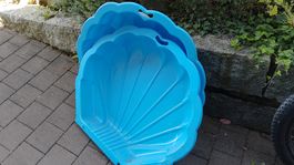 Sandkasten-Planschbecken-Muschel