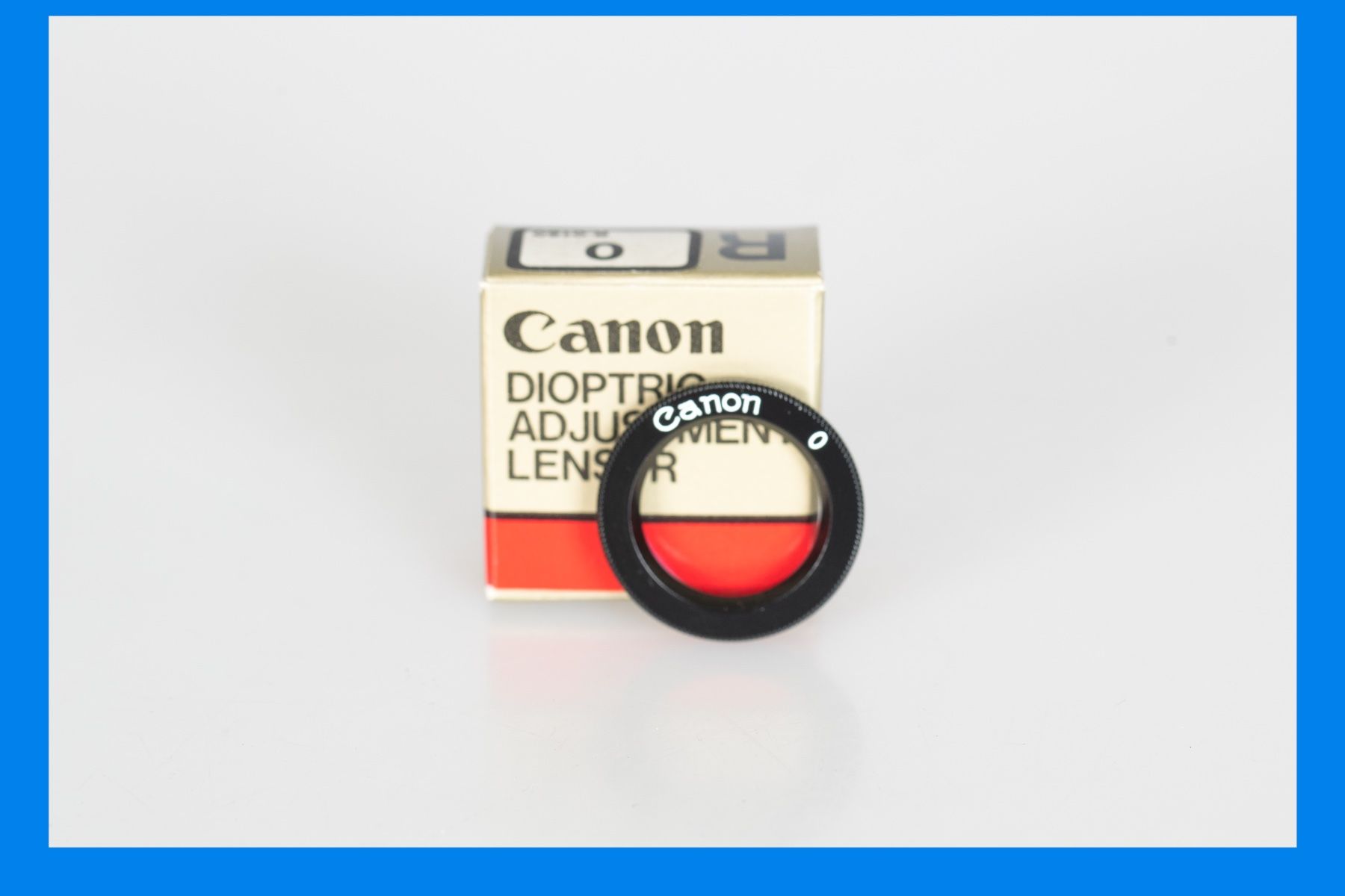 Plaketten & Abzeichen: Canon Dioptric Adjustment Lens R – Gebraucht aus Muralto von FotoGarbani