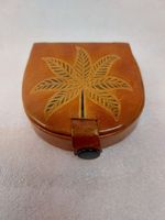 Handcrafted leather coin purse with floral decoration
