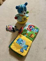 Lot jouets bébé culbuto musical + livre tissu