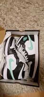 Jordan 1 Mid Weiss/GrünGlow/Schwarz
