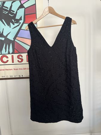 Black sleeveless V-neck dress with beads