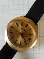 Vintage ENICAR Watch: Gold-Tone Dial, Sleek Black Strap