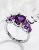 Eleganter Ring mit lila Steinen, 925 versilbert, Gr. 6
