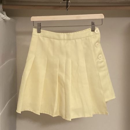pastel yellow pleated skirt