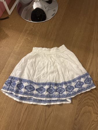 Cute white summer skirt with blue embroidery