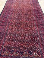 Tapis rouge / bordeaux à motifs