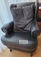 Massiver schwarzer Ledersessel mit grossem Lederkissen