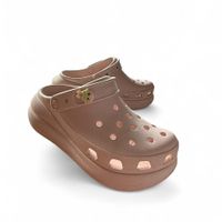 baby pink platform crocs with little pin