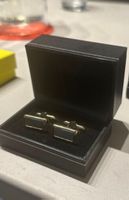 Boutons de manchette dans boite