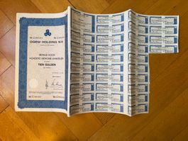 Ogem Holding Aktie 1973 Tien Gulden Blau m. Couponbogen
