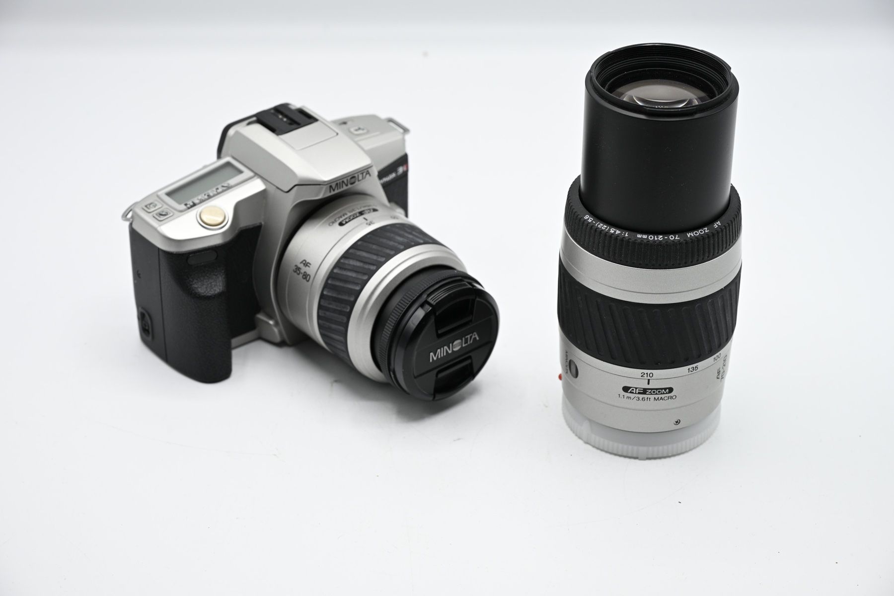 Minolta Fotocamera: Minolta Dynax 3L + 35-80mm + 70-210mm, Argento – Usato da Bellinzona venduto da CarpiFotoSA 4