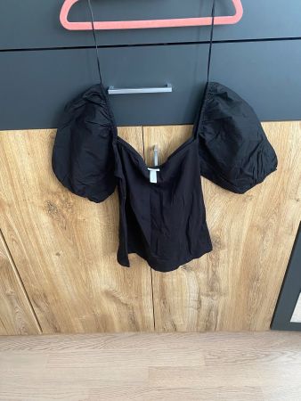Top noir H&M manches bouffantes taille S élégant