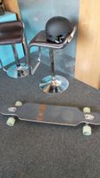 Longboard und Helm