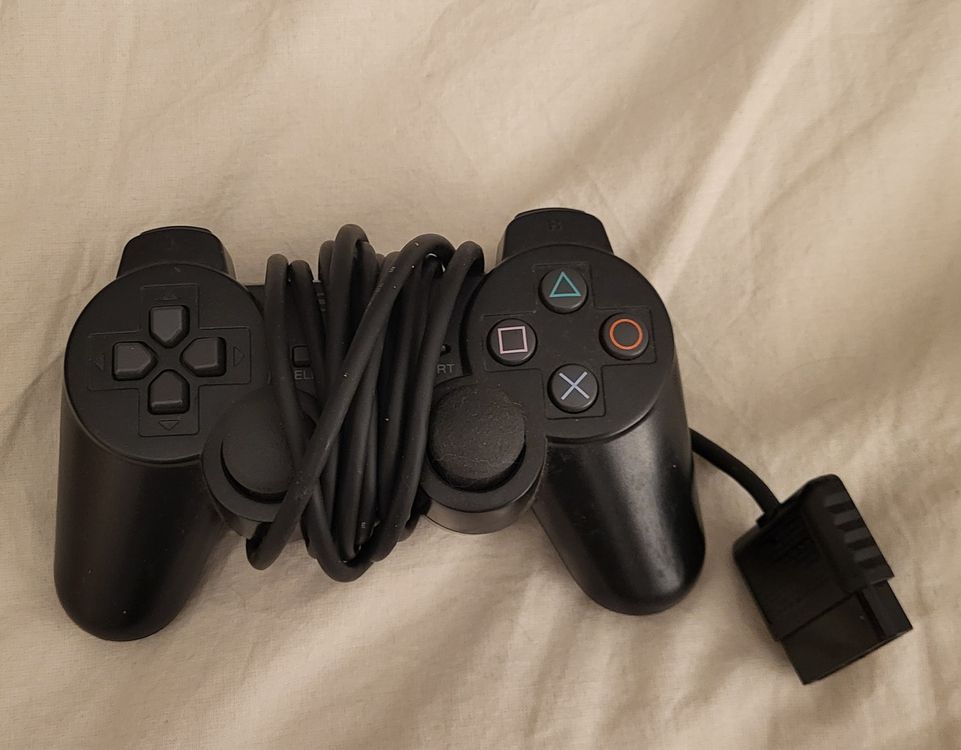 Manette PS2 D'occasion Pour PlayStation 2 - Fonctionnelle, Avec Quelques Marques D'usure