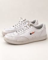 Baskets Nike blanches – logo noir/orange – très bon etat