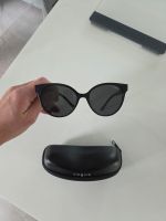 Lunettes de soleil Vogue noires,