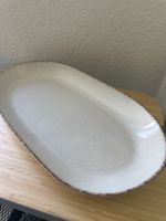 Oval serving platter, stylish beige stoneware, perfect for s