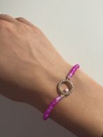 Handgefertigtes rosa Armband mit Evil Eye Anhänger